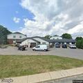 Person found sleeping under truck at apartments