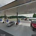 Officer checks suspicious vehicle at gas station