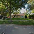 Caller reports unfamiliar car outside driveway