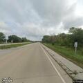 Empty white sedan found in ditch near gas station