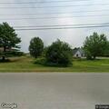 Group on motorcycles doing burnouts in roadway