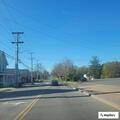 Welfare check on woman sitting by roadside