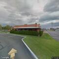 Officer assists man retrieving phone at restaurant