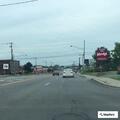 Officer checks red car near Chick-fil-A on Route 3