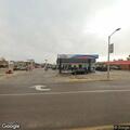 Suspicious person recording worker at gas station