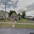 Power pole down on home with residents inside