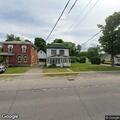 Officer attempts service at Washington Street home