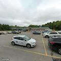 Traffic stop on blue Subaru at village market