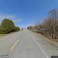 Male running on road yelling at cars on Moosehead Trail
