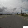 Woman walking in roadway near Deaver