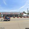 Traffic stop on white Mustang at farm supply