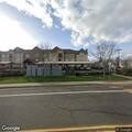 Person with severe back pain near Northwest Jasper Street