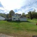 911 hang-up with open line at Central Street home