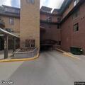 Person with back pain near Promenade Avenue