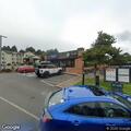 Person banging on building and yelling near market