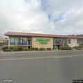 Man running in and out of road near Dollar Tree