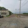 Woman falls and hits head on concrete at intersection