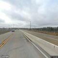 Three-wheel motorcycle stalls on bridge, blocking lane