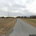 Four-wheelers riding repeatedly on gravel road