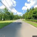 Gray Tesla drives out of driveway into road