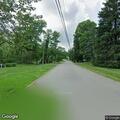 Low tree limb blocking lane on Mountain and Brookwood