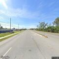 Officer checks blue sedan after crash on Starkey Rd