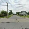Person walking in roadway near Broadway Street