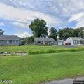 Tree falls on house, power line hazard reported