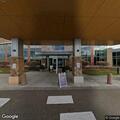 Person experiencing abdominal pain at urgent care in Plymouth
