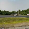 Two-vehicle crash with fluid leak near gas tank