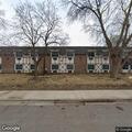 Person experiencing abdominal pain near 2nd Street Southeast, Osseo