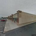 Car parked in handicap space at strip mall