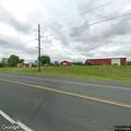 Utility pole fire spreading to nearby grass