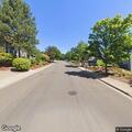 Person experiencing back pain at residential address
