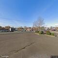 Person suffering from severe hemorrhage in parking lot