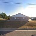 Person experiencing breathing problems at home