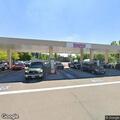 Person experiencing severe back pain in Hillsboro parking lot