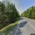 Tree blocks Lily Bay Road at Prong Pond Road