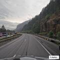 Person lying roadside near Columbia River railroad bridge