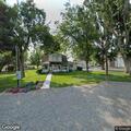 Debris and garbage cans blocking sidewalk reported