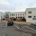 Tree knocks down line in road behind facility