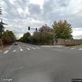Green car blocking left turn lane on highway