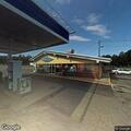 Officer checks vehicle at Sherman gas station