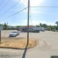 Car driving on shoulder near Deer Island Store
