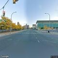 Man talking while lying in road at North Salina Street