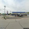 Gas drive-off by older green truck at station