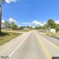 White truck runs off roadway; patient reports back pain