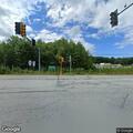 Person standing in roadway at Spring and Gardner
