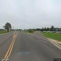 Bucket of tar leaking on roadway at intersection