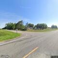Person with severe back pain at County Road 121